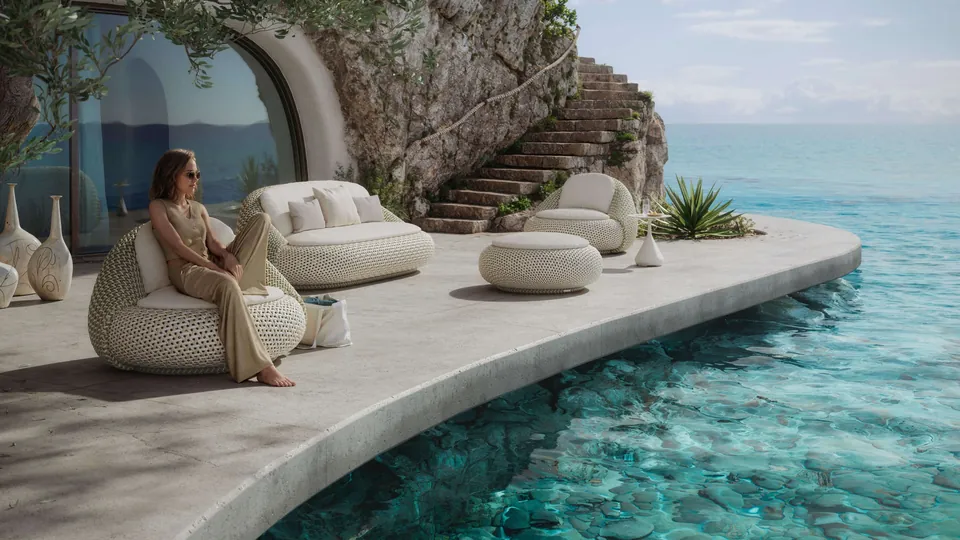 Dedon Atolo 2-seater outdoor sofa and lounge chair woven in three tones of Dedon Fiber