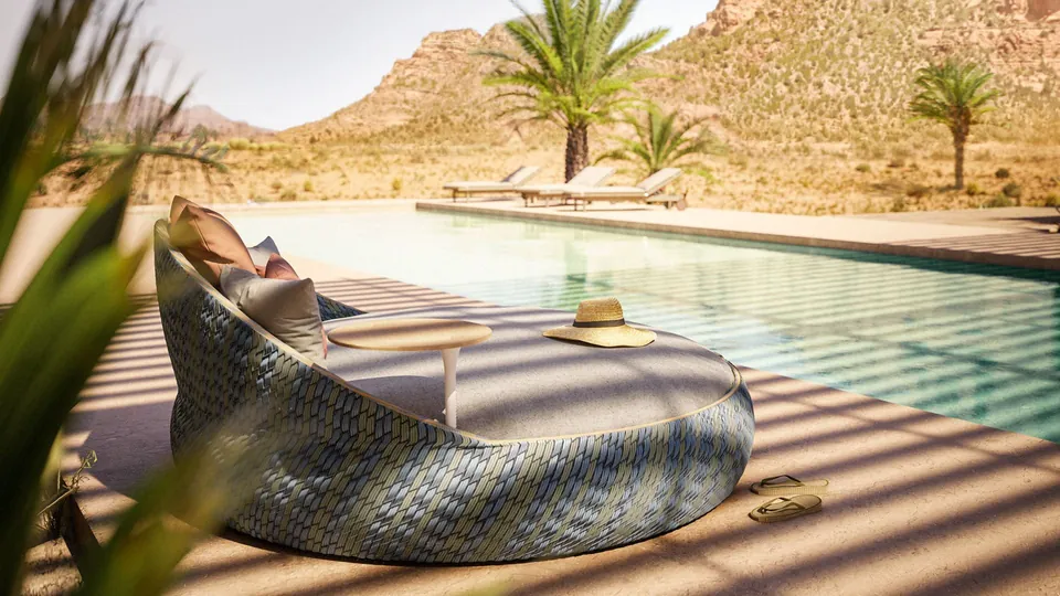Dedon outdoor furniture priced on request, Dala lounge chair woven by hand on a patio