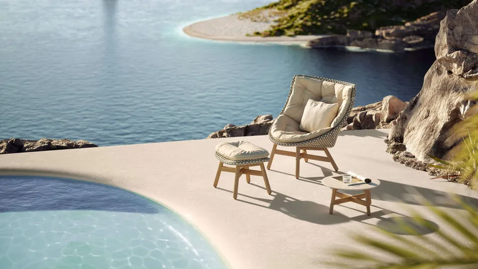 Dedon patio furniture on a terrace, Mbrace lounge chairs woven from Dedon Fiber with teak legs