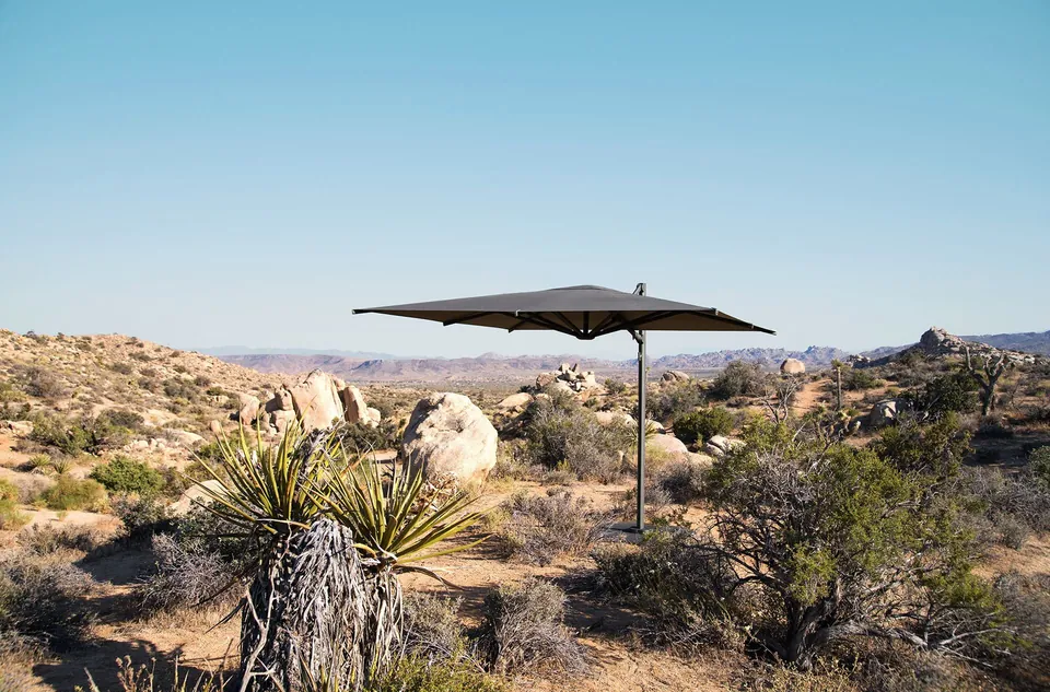 Dedon Reav Hexagon S parasol in anthracite shading outdoor seating